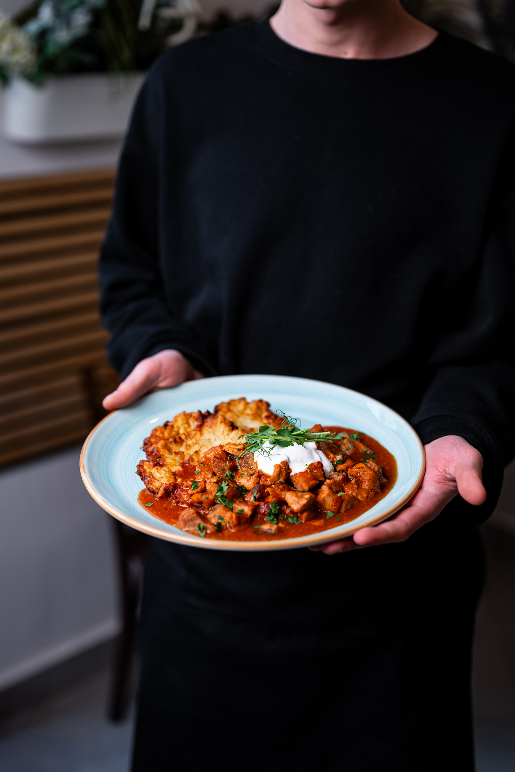 Hungarian-style potato pancakes with pork goulash